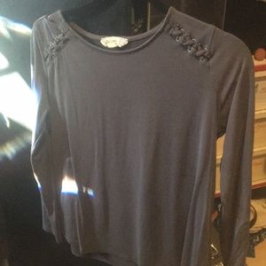 A gray cris cross shoulder